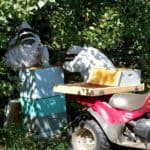 Loading the boxes on to the four wheeler. Loading the boxes on to the four wheeler.